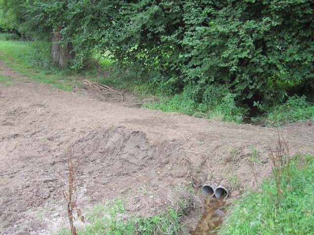 The stream flows through the pipes
